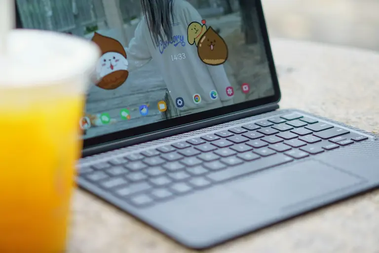 an open laptop computer sitting on top of a table