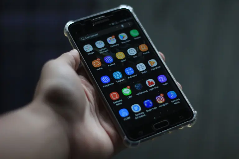 Close-up of a smartphone showcasing various mobile applications on its display.