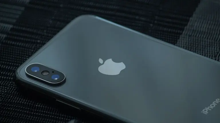 High-quality close-up of a sleek smartphone's back, showcasing the camera and logo.